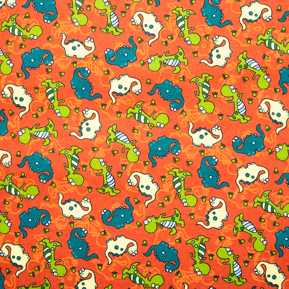 CHARLIE Printed Flannelette - Dino dance - Pumkin